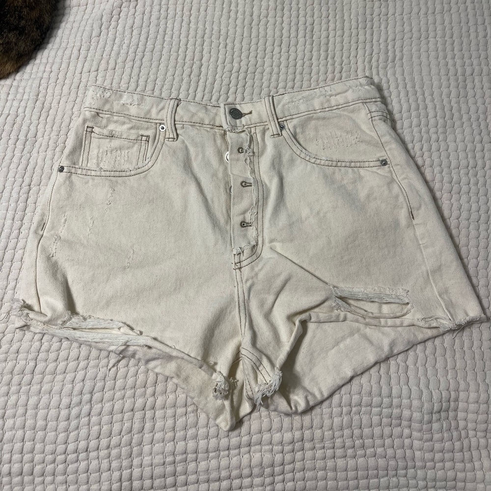 distressed cream denim shorts